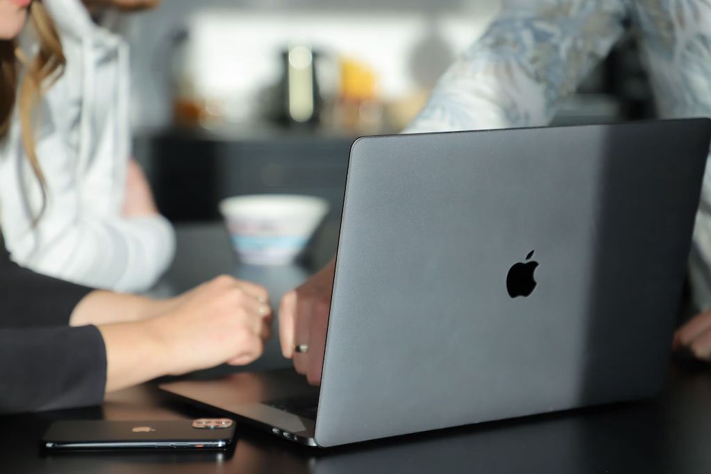 People working on a Mac computer